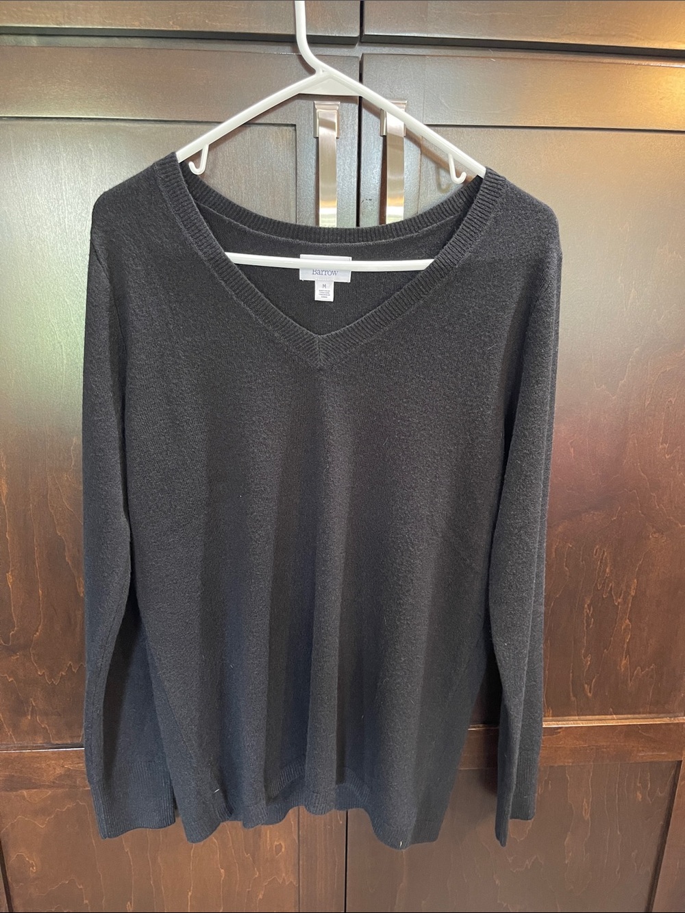 Black V-Neck women’s Sweater, NWOT, never worn. Size medium.